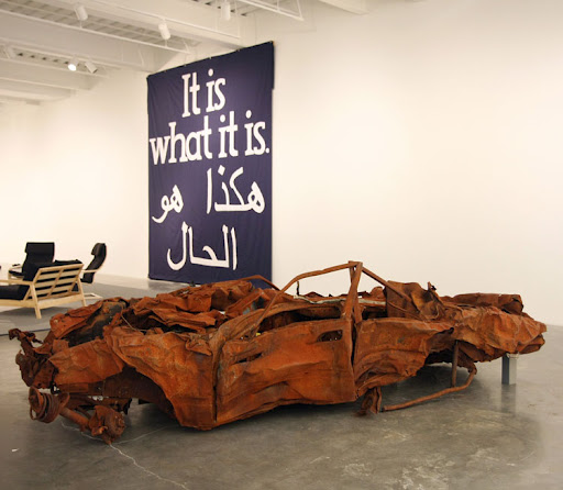 Remains of a bombed car in an art gallery