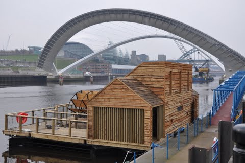 A modern wooden waterwheel and mill on the River Tyne